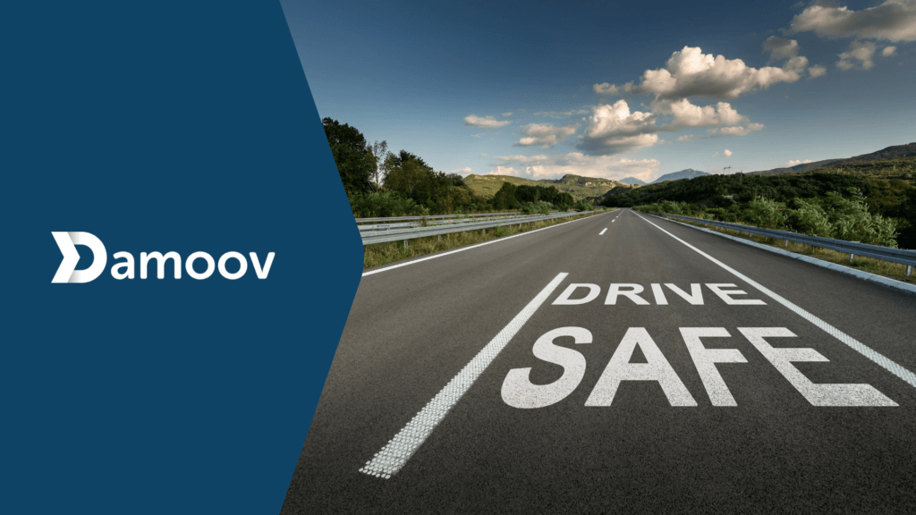 "Drive Safe" message painted on an open highway, emphasizing the importance of safe driving practices empowered by Damoov's Mobile Telematics.