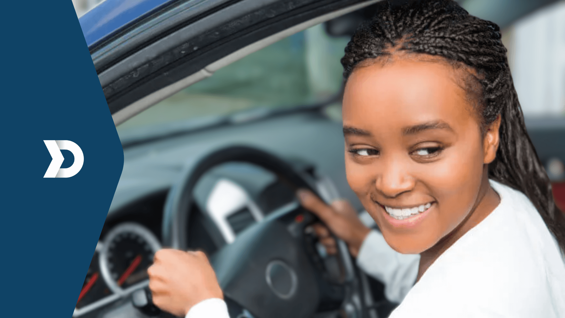 A smiling driver looks over her shoulder while holding the steering wheel, symbolizing the benefits of driver monitoring technology powered by Damoov's mobile telematics for safe driving.