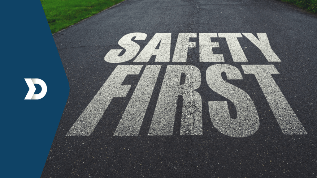 "Safety First" written on a road, representing the importance of safe driving and road safety practices that can be enhaced with Damoov's Mobile Telematics.