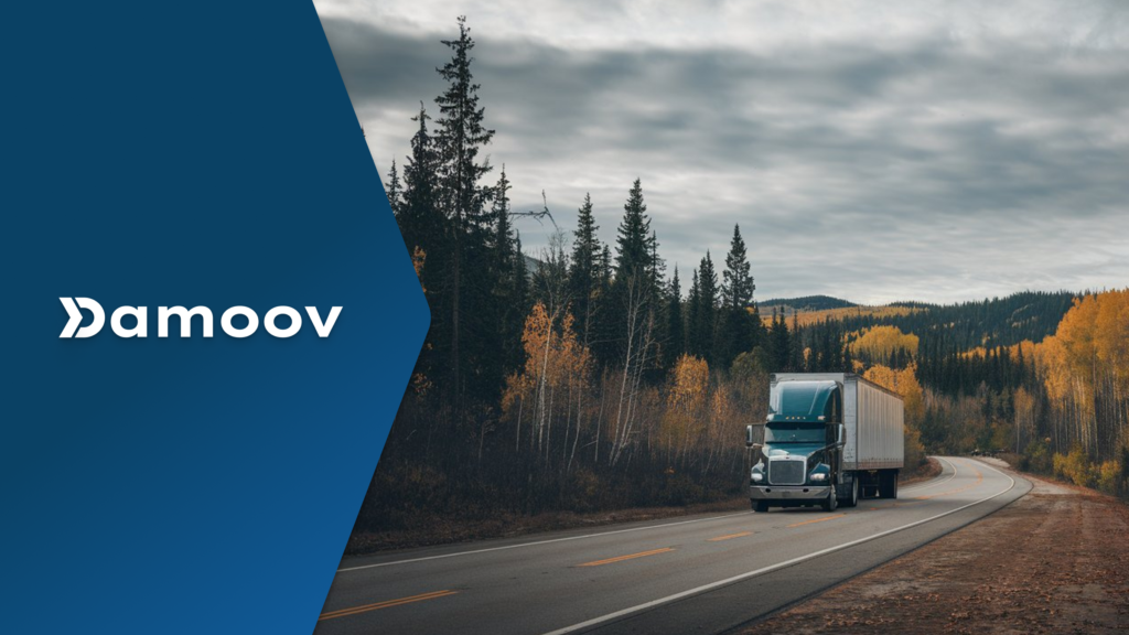 A semi-truck driving on a scenic rural highway surrounded by autumn trees, symbolizing the role of mobile telematics in usage-based leasing models.