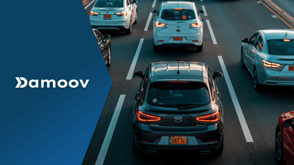 Multiple cars driving on a multi-lane highway during sunset traffic, symbolizing the role of mobile telematics in monitoring driving behavior and potentially replacing dashcams.