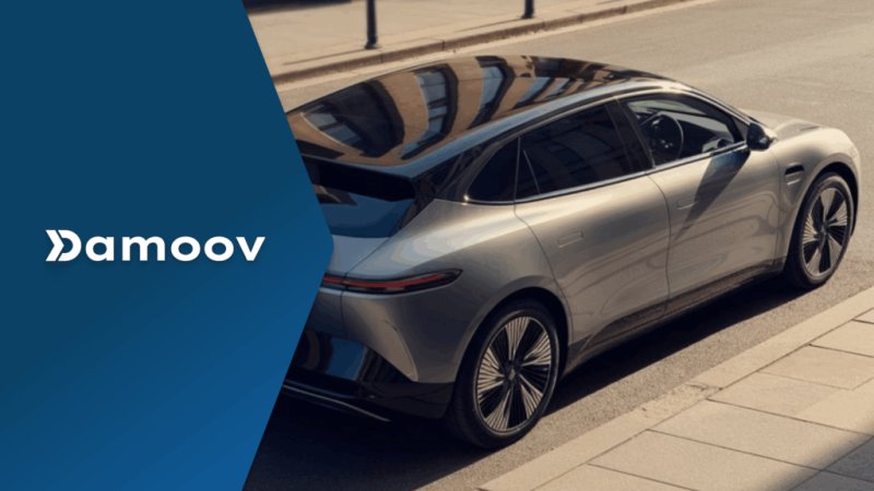 Modern electric vehicle driving in an urban environment, representing eco-driving rewards and mobile telematics sustainability solutions.