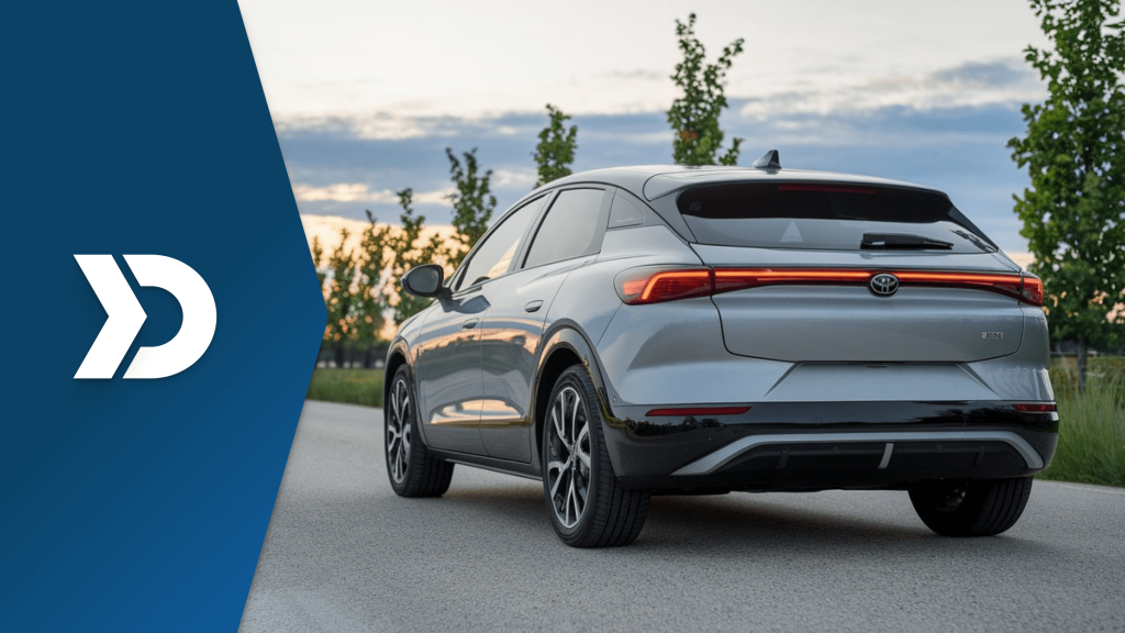 Rear view of an electric vehicle on the road at sunset, representing next-gen auto insurance powered by mobile telematics.