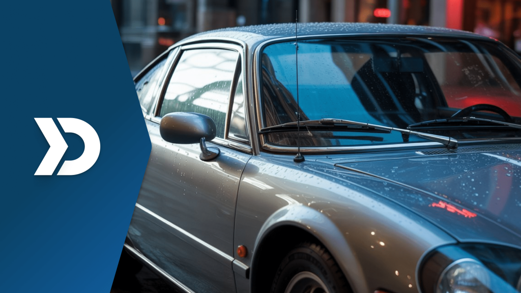 Close-up of a classic silver car with rain droplets, symbolizing legacy vehicle data integration with modern mobile telematics consensual privacy practices.