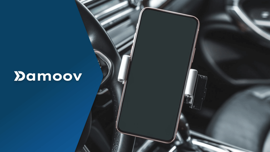 Smartphone mounted on a car dashboard using a holder, illustrating app-based mobile telematics technology for driver behavior tracking.