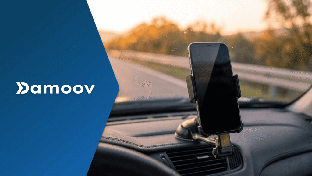 Smartphone mounted on a car dashboard using mobile telematics for fleet tracking, GPS monitoring, and driver behavior analytics