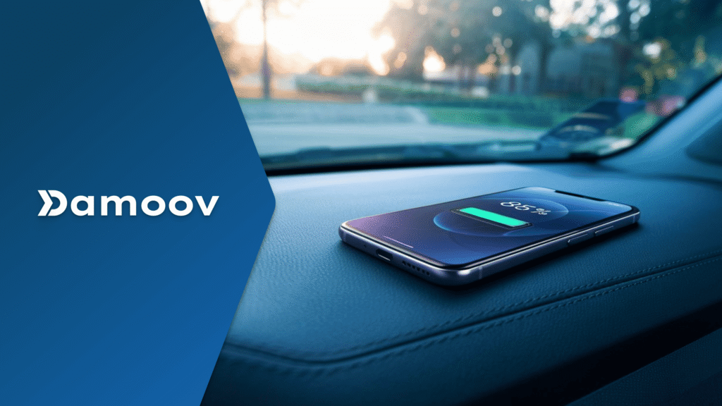 Smartphone on a vehicle dashboard illustrating battery-efficient background trip detection using mobile telematics, low-power GPS tracking, and automatic trip detection technology.